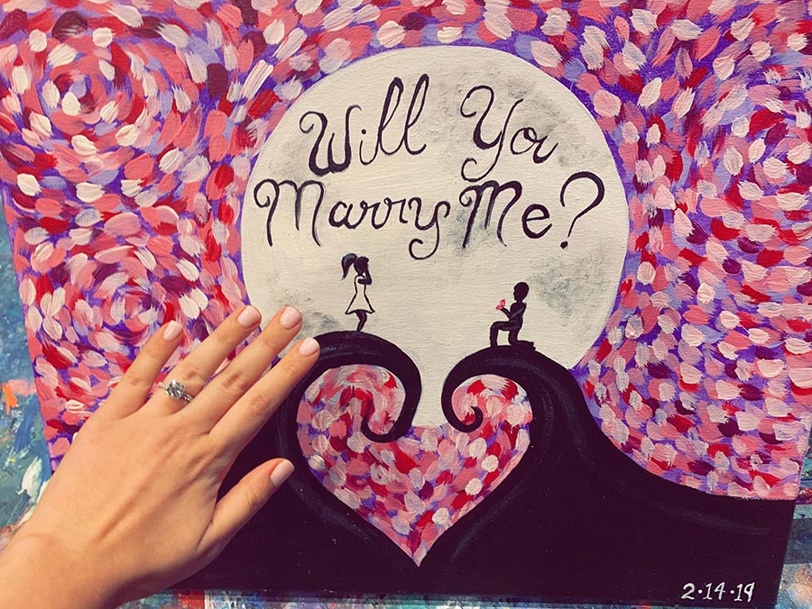 will you marry me image with engagement ring on hand