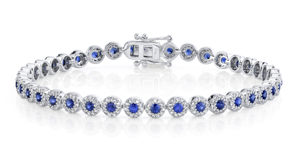 A white gold sapphire and diamond tennis bracelet.