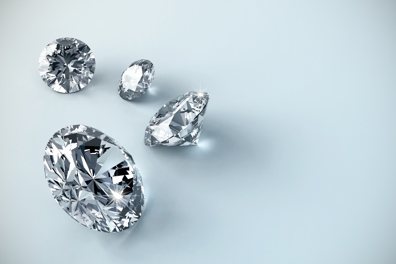 Several diamonds scattered on a wide background