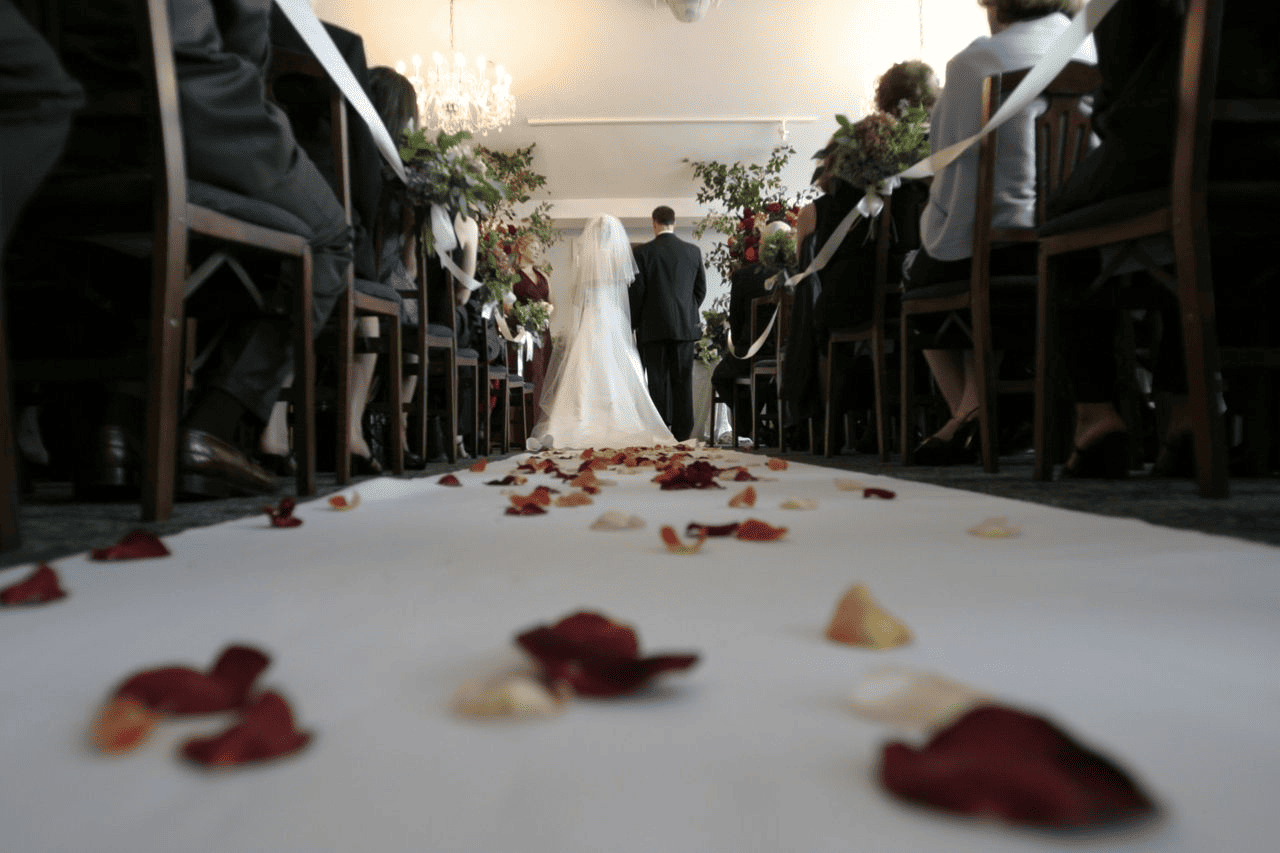 A couple stands at the altar during their wedding ceremony.